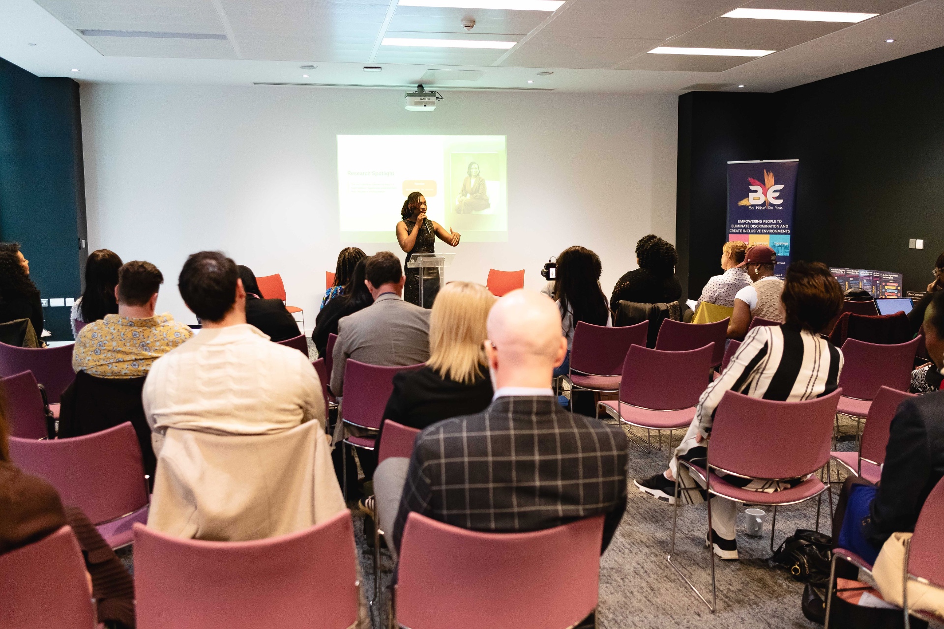 Mary Fashanu speaking at a leadership event from a lectern