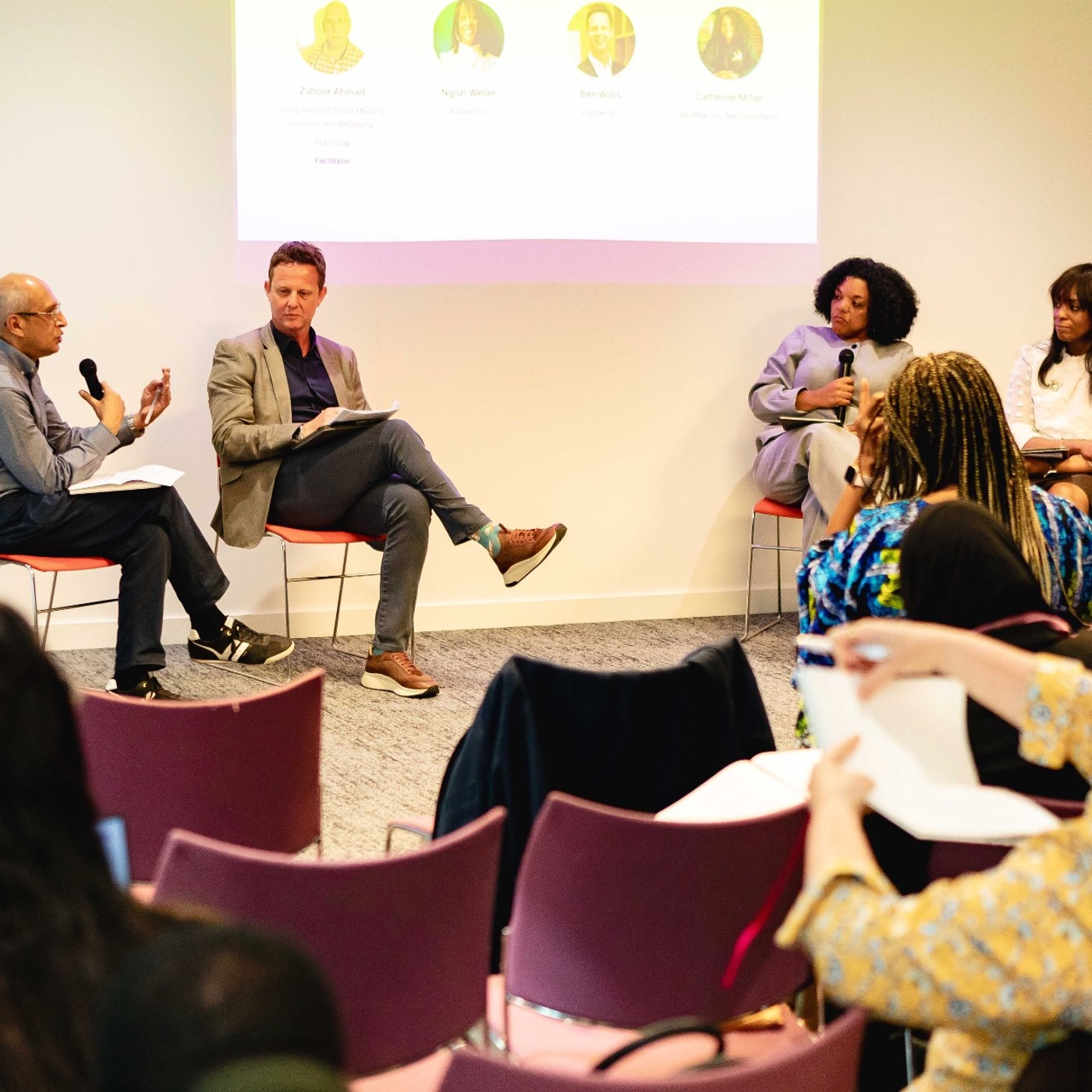 Panel discussion in front of a full room