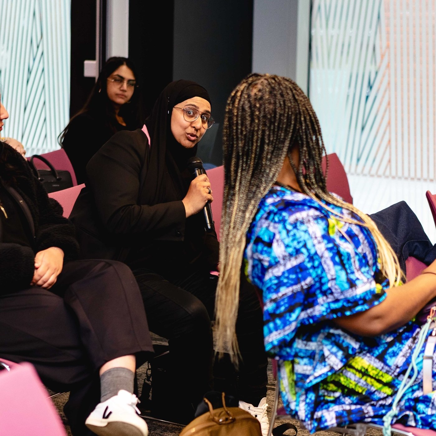 Attendee asking a question during an open discussion