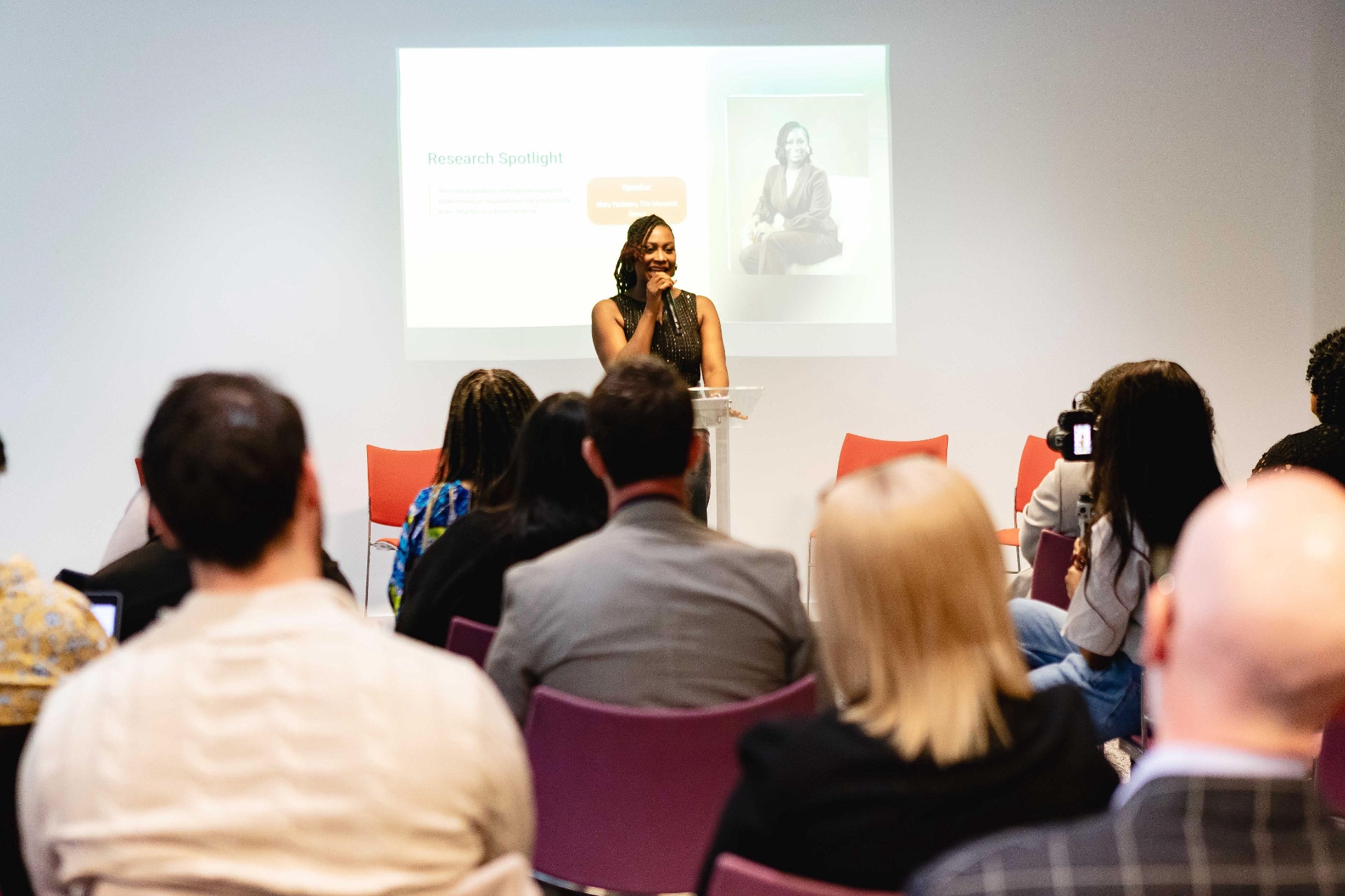 Mary Fashanu speaking from a lectern at a leadership event